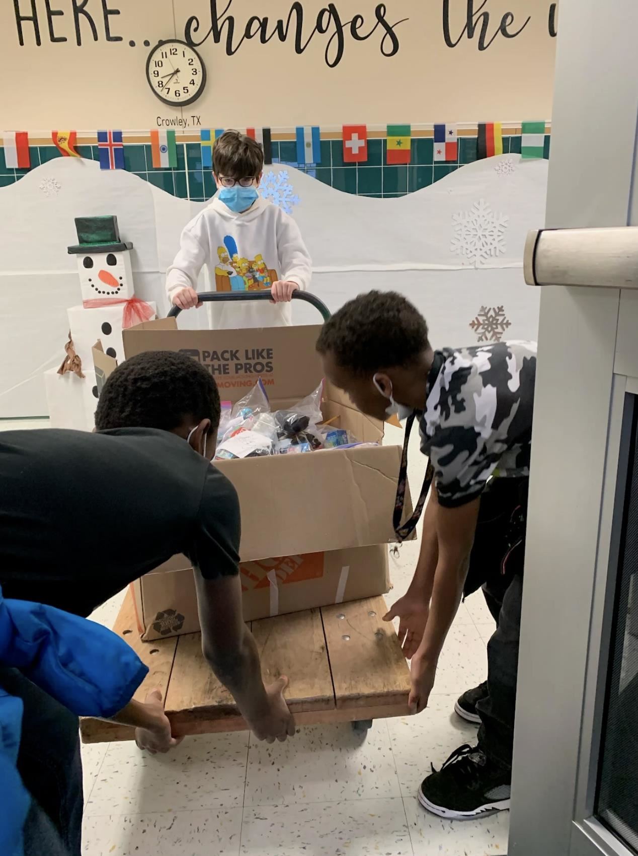 Deer Creek Elementary Students with a cart full of items